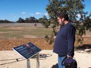 Mark examining exhibits