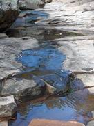 Flowing water reflecting sky