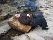 Carolyn resting on rock