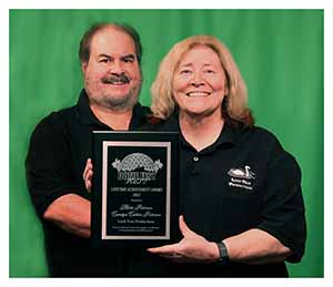 The Nessies hold the plaque